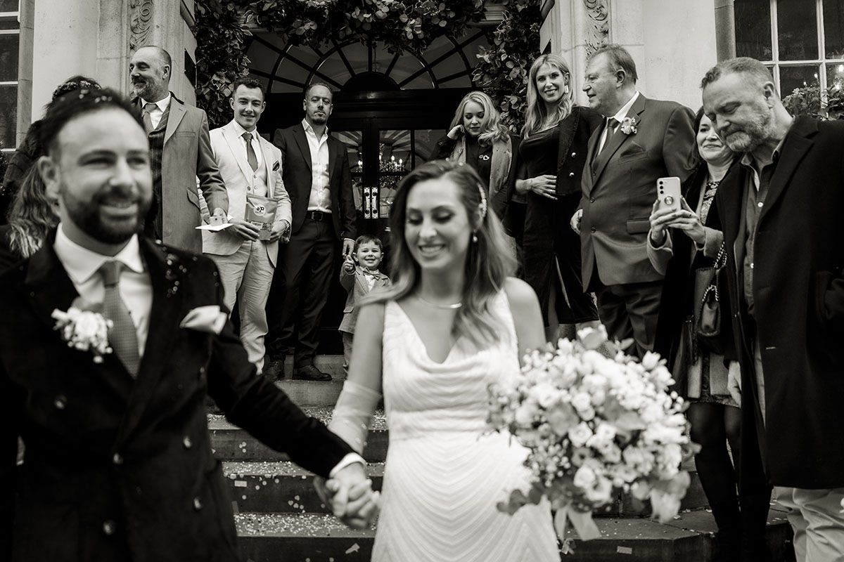 Natural, candid shot of smiling newlyweds