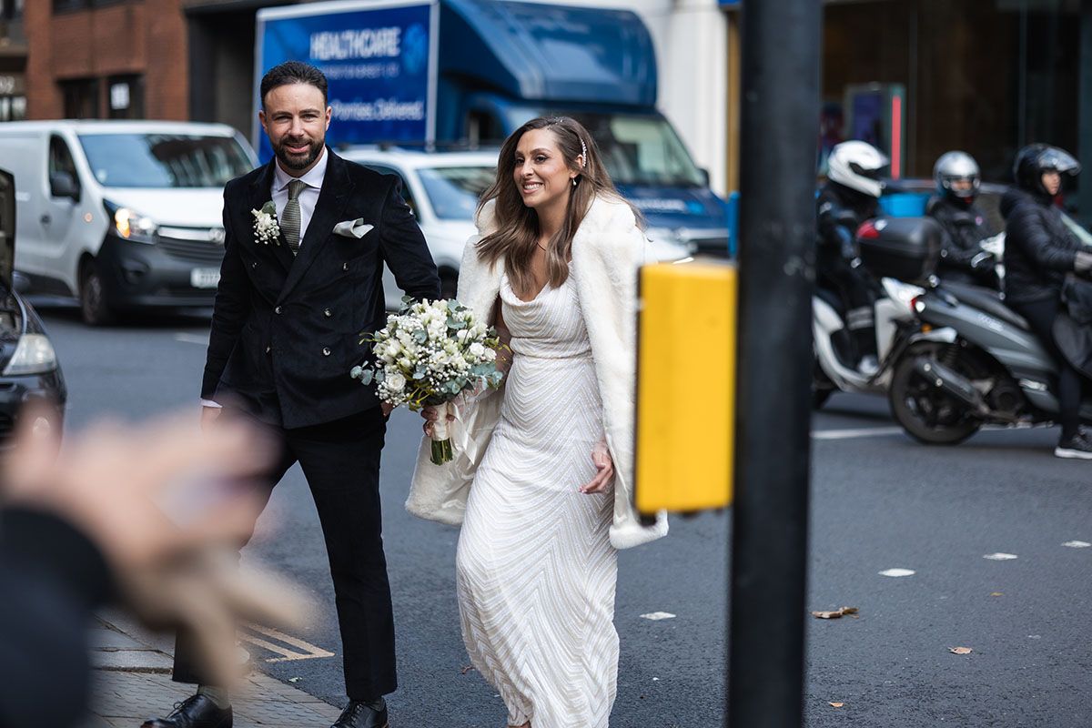 London city elopement. Street photography of bride and groom.