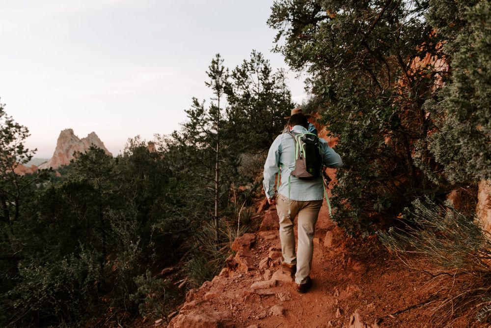 couple hiking in Colorado during their adventurous couples session