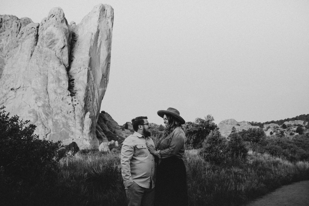 couple looking at each other during engagement photos in Colorado springs