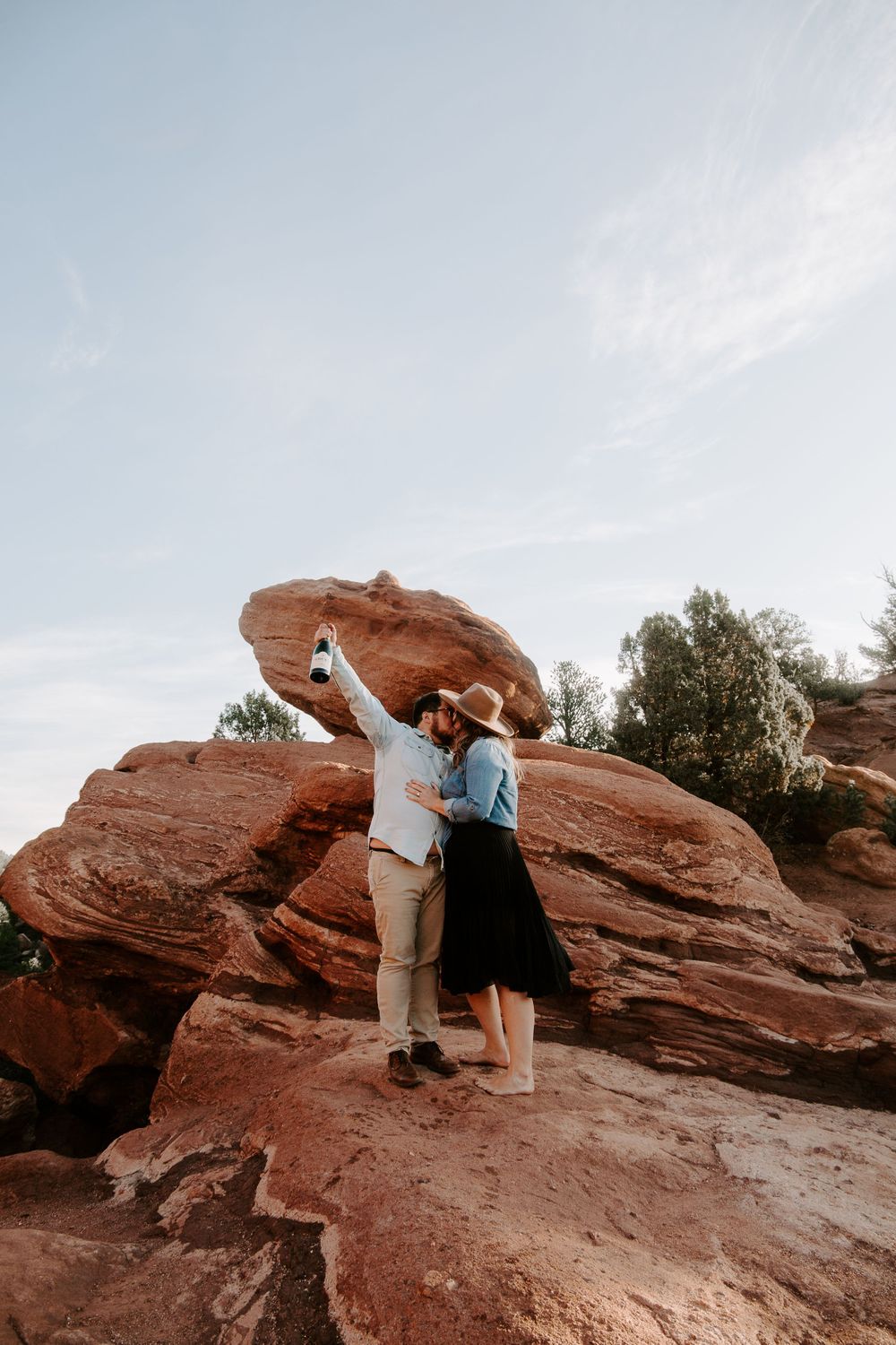 couple kissing after they got engaged in Colorado springs