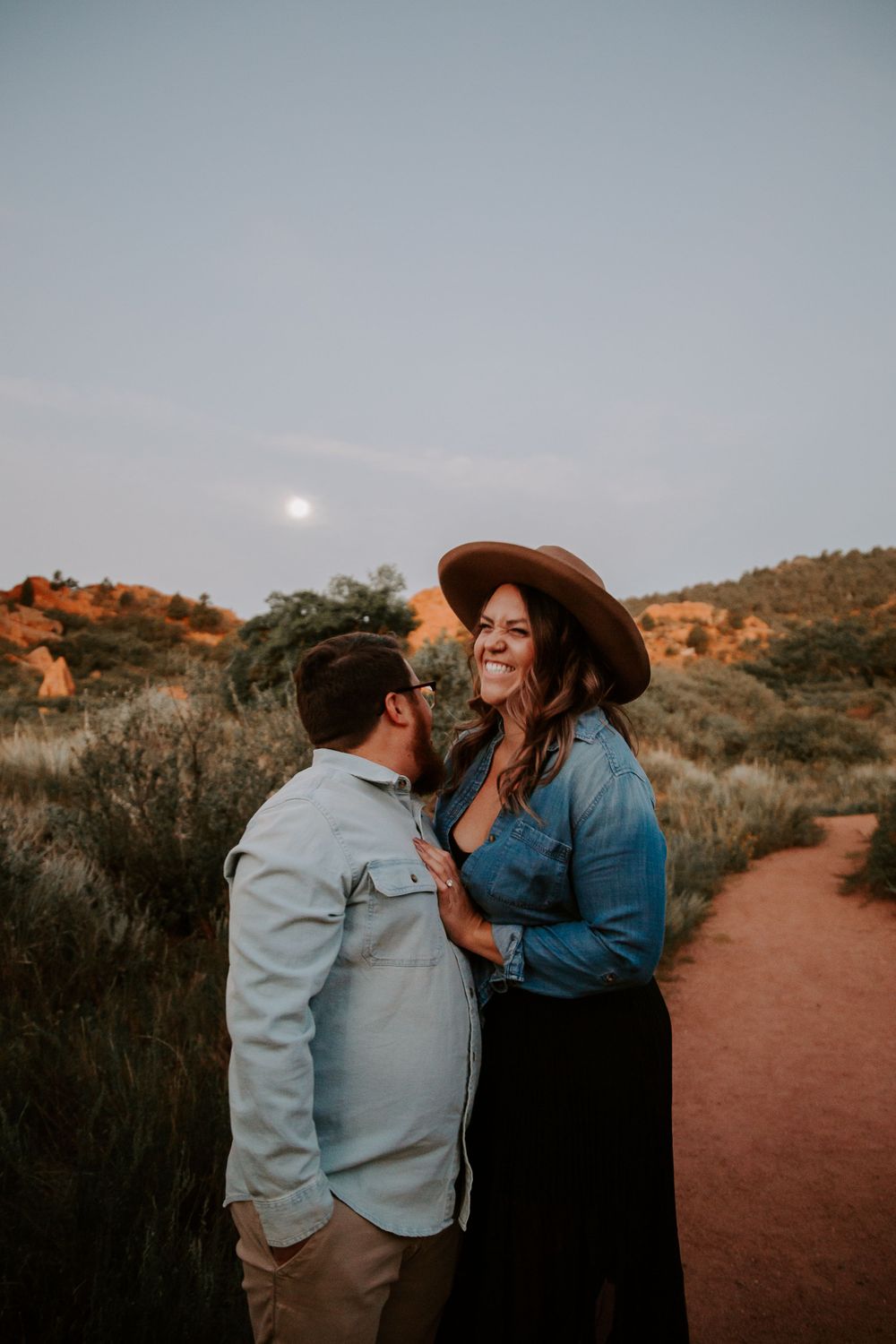 woman laughing during a couples photoshoot in Colorado
