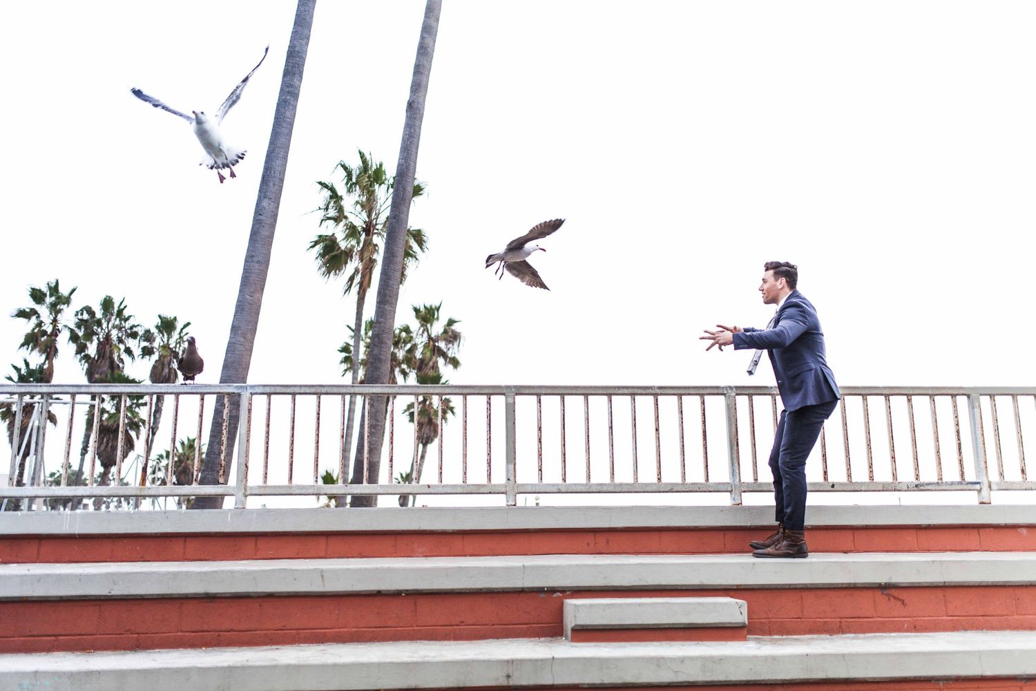 Actor Christian James Smoking in Suit Men's Fashion Trends Handball Court Venice Beach Interview Magazine