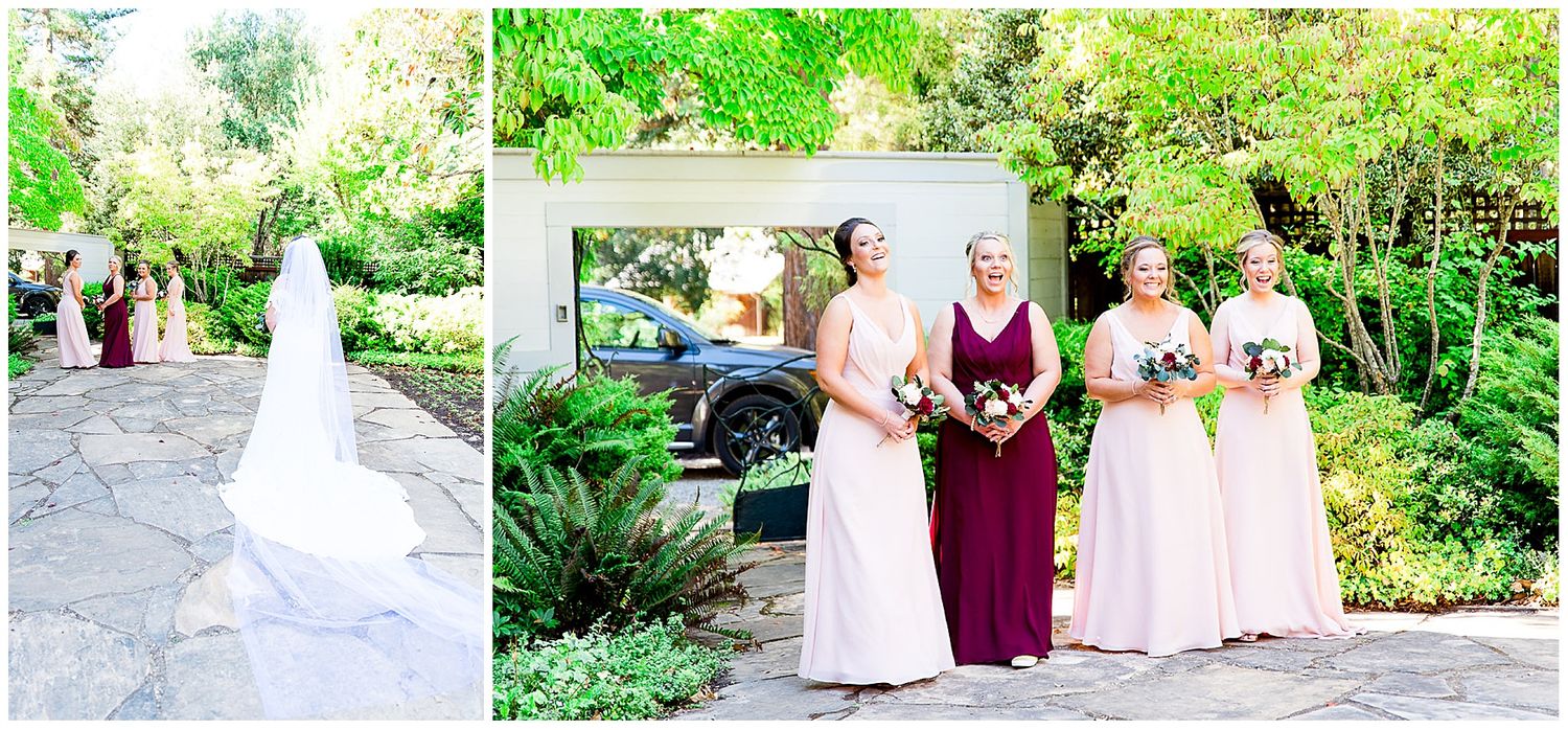 bridesmaids in blush and maroon look at the bride for the first time on her wedding day in Northern California