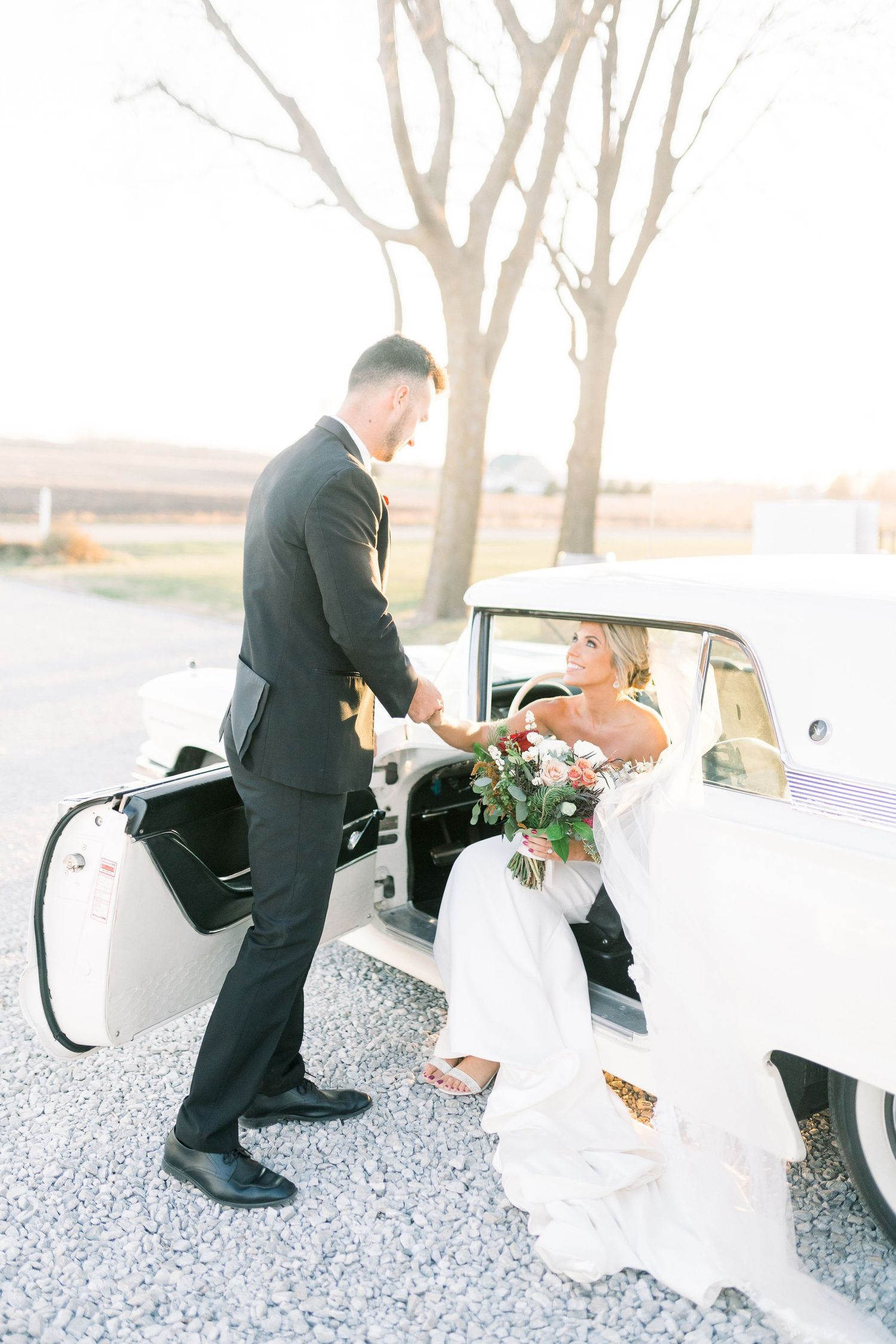 Light and airy Elopement wedding with vintage car at 1868 Farmhouse Wedding in Boone, Iowa with Modern Dress bridal gown