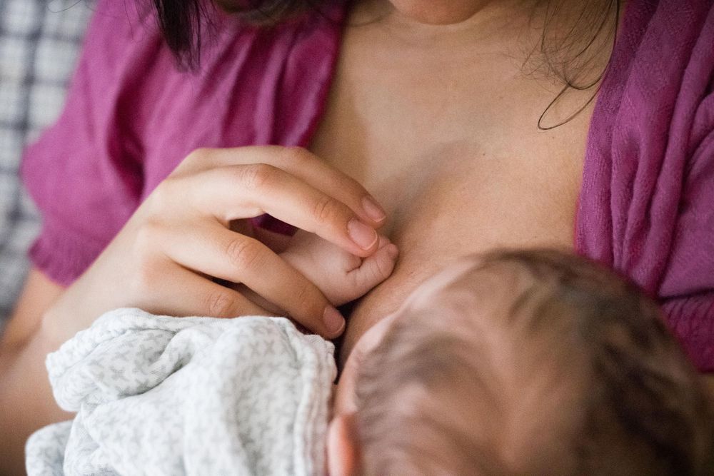 mama breast feeding baby