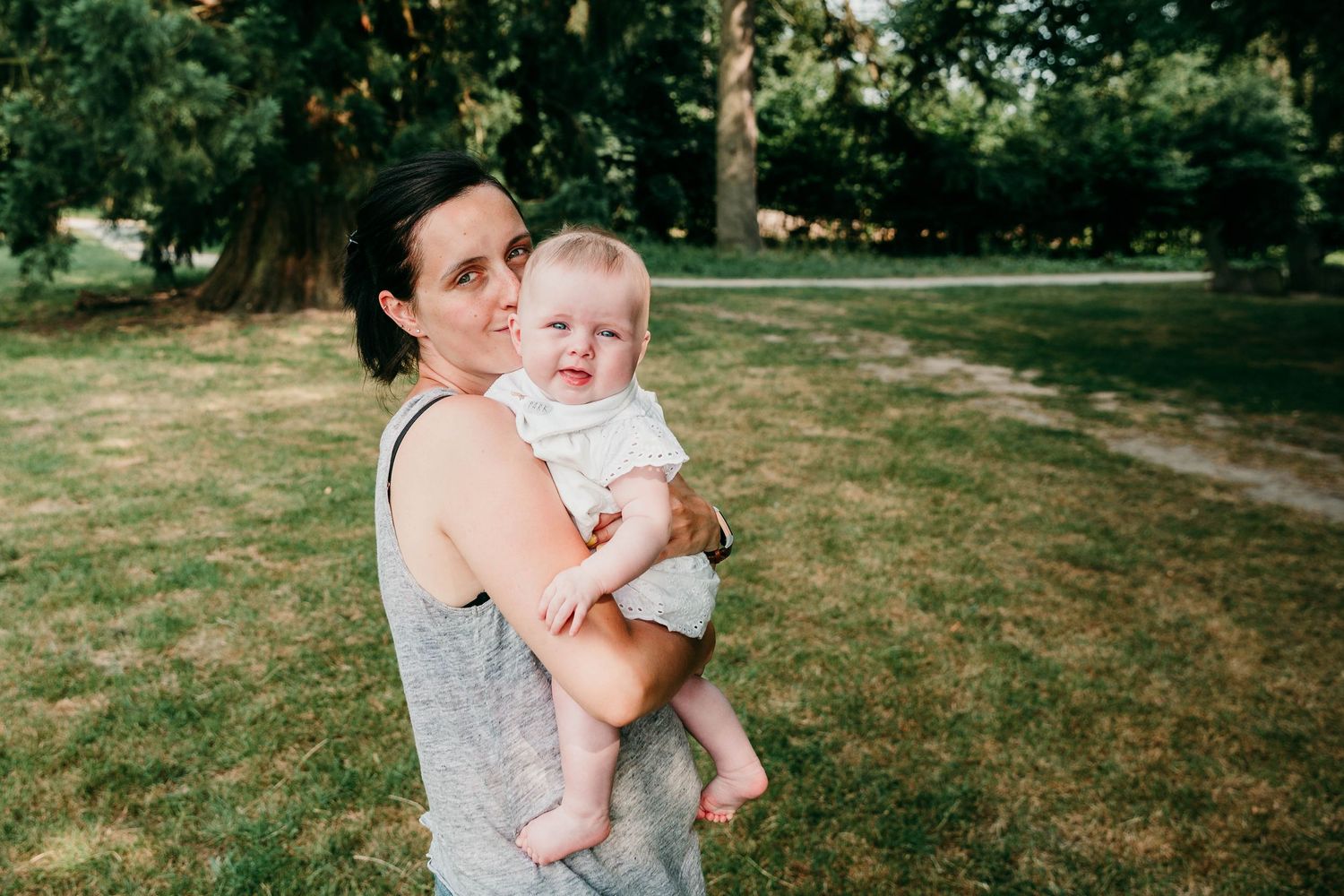 mum holding 6 month old baby girl