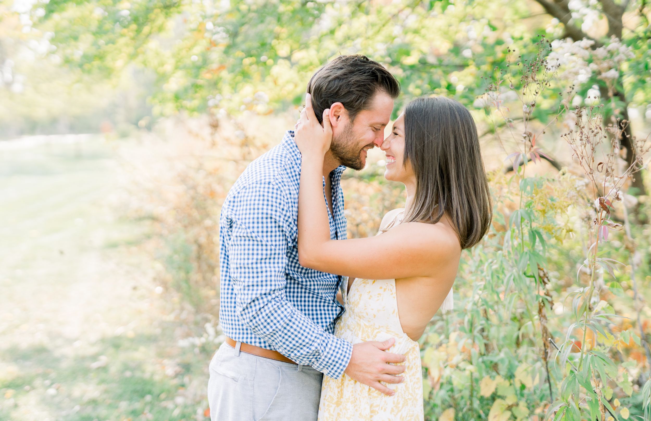Des Moines Engagement photos at Grays Lake in downtown Des Moines, Iowa with light and airy photographer Nicole Laing