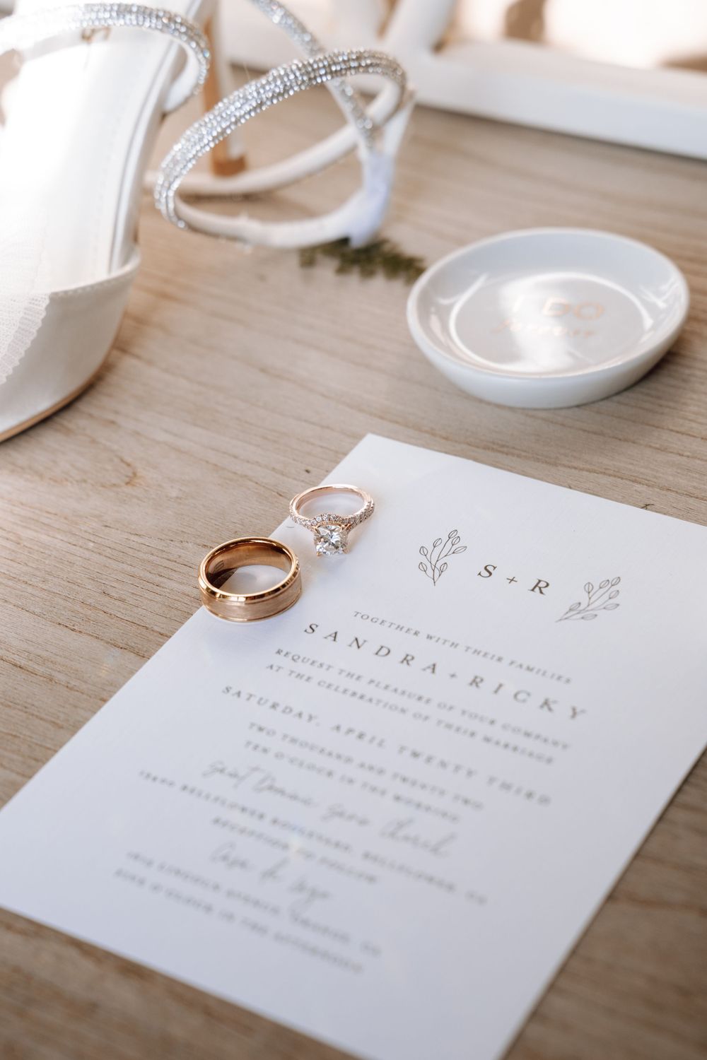 Close-up shot of wedding invitations and rings, shot by natural light photographer Melina Garcia
