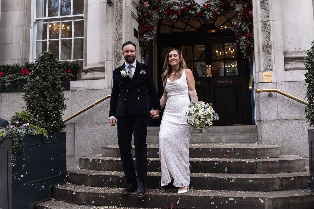 Photo of the bride and groom in front of the registry office.