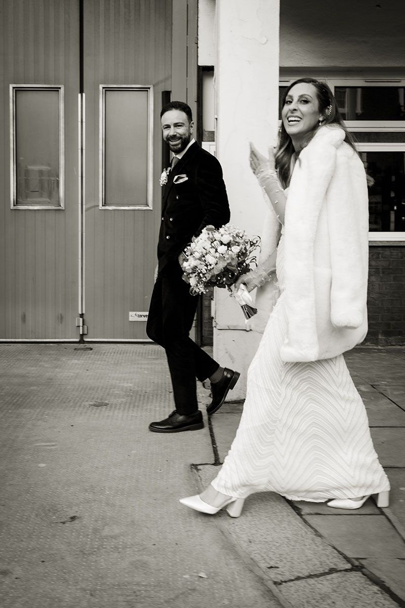 Street photography of wedding couple in winter wedding.