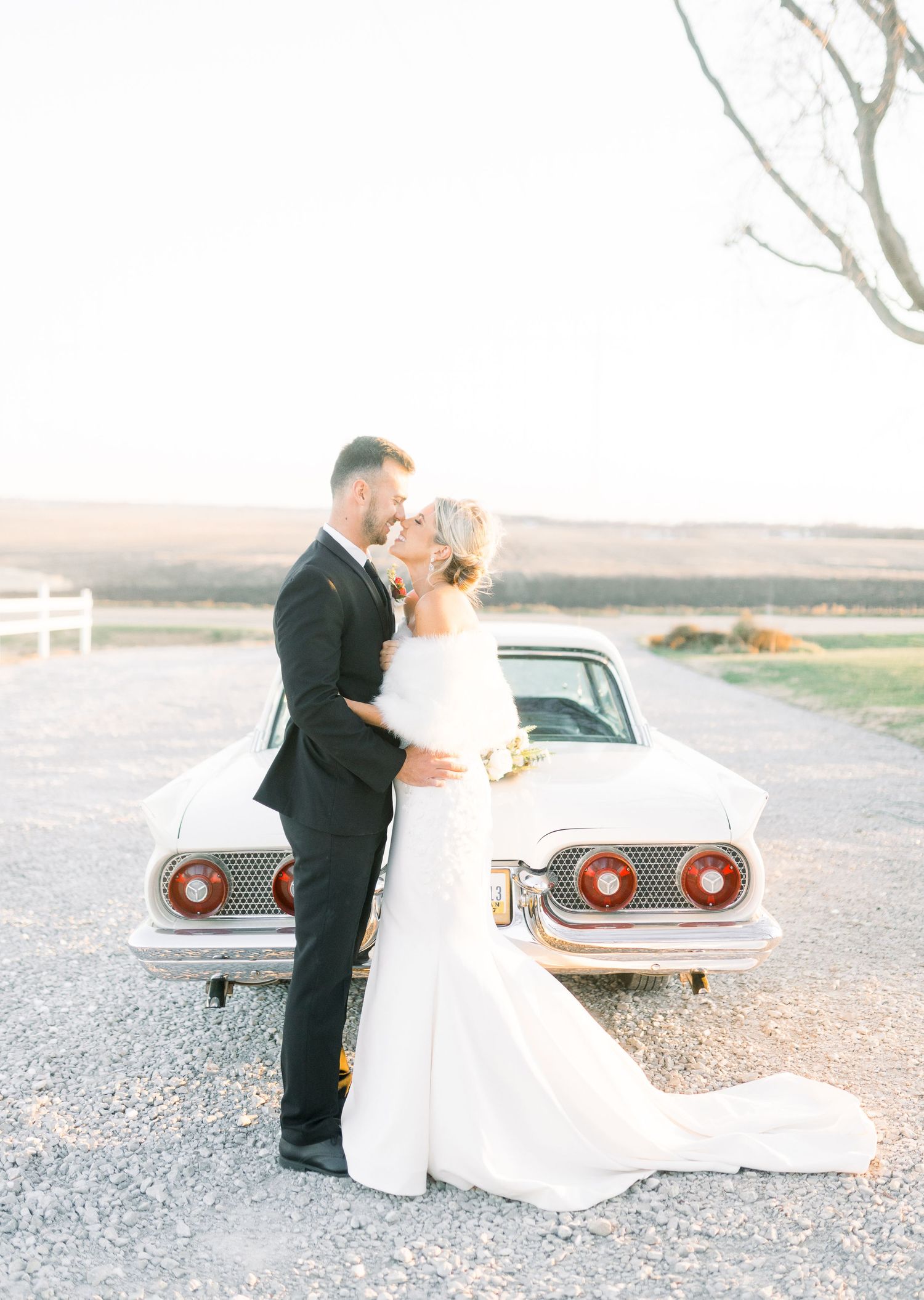 winter wedding at 1868 Farmhouse Wedding in Boone, Iowa with Modern Dress bridal gown