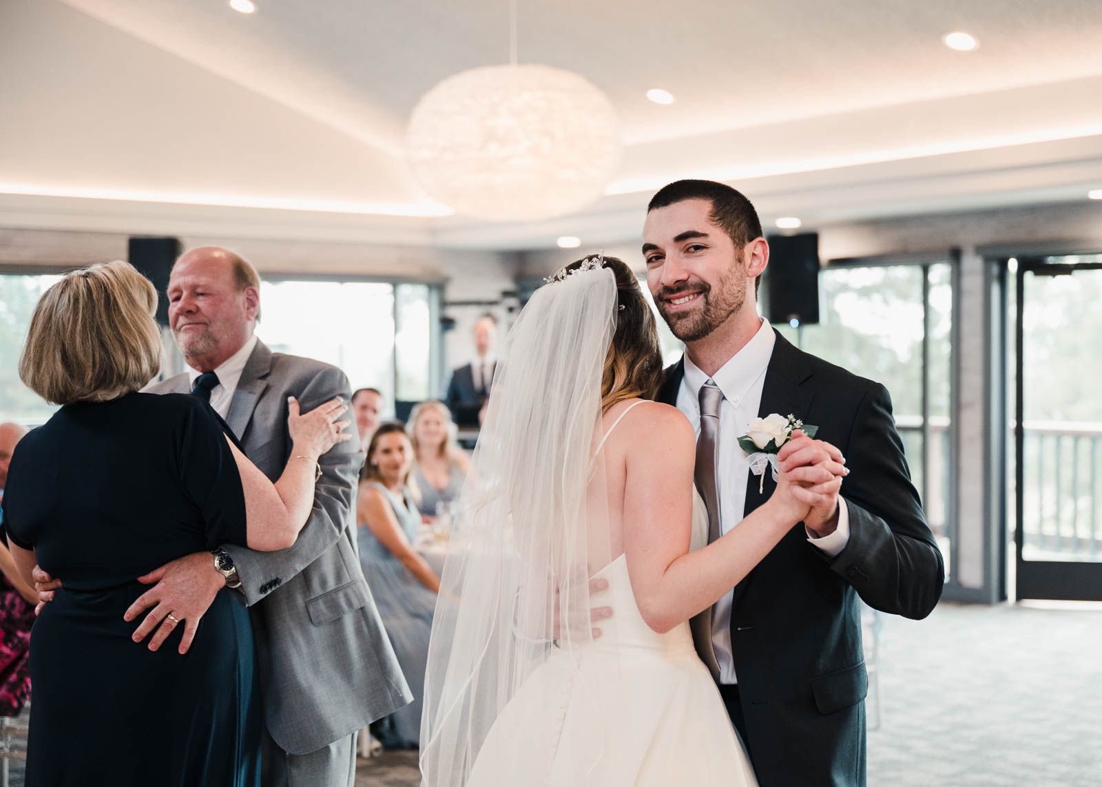 groom smiling during special dances