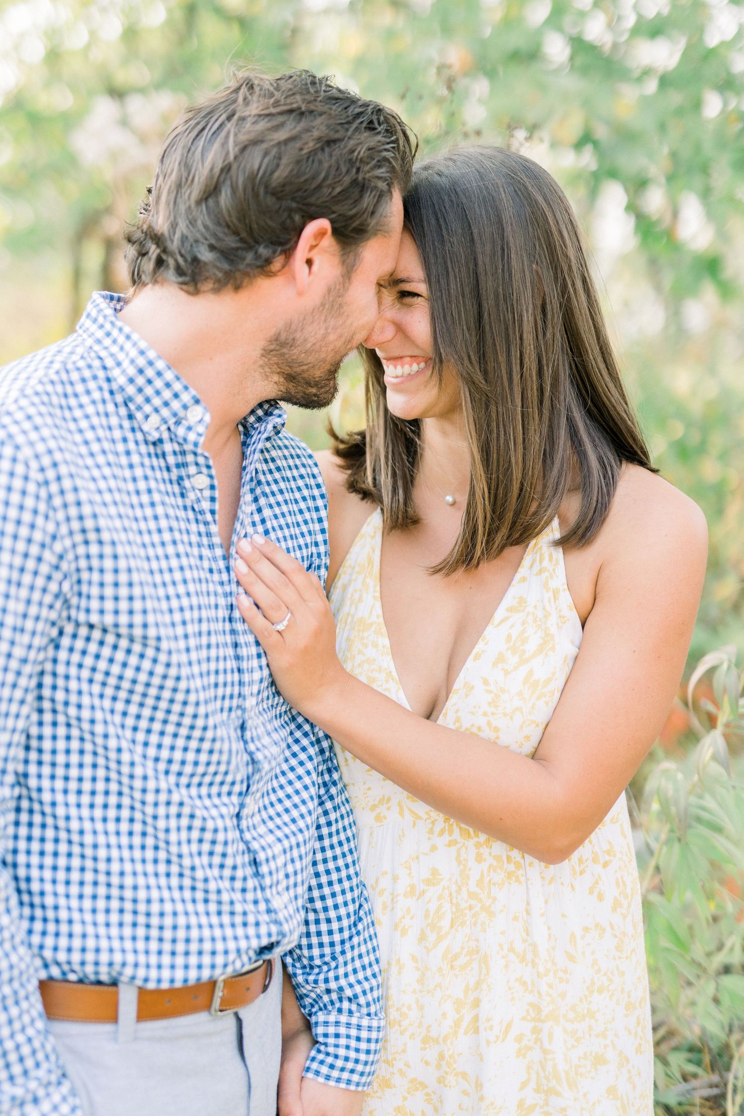 Des Moines Engagement photos at Grays Lake in downtown Des Moines, Iowa with light and airy photographer Nicole Laing
