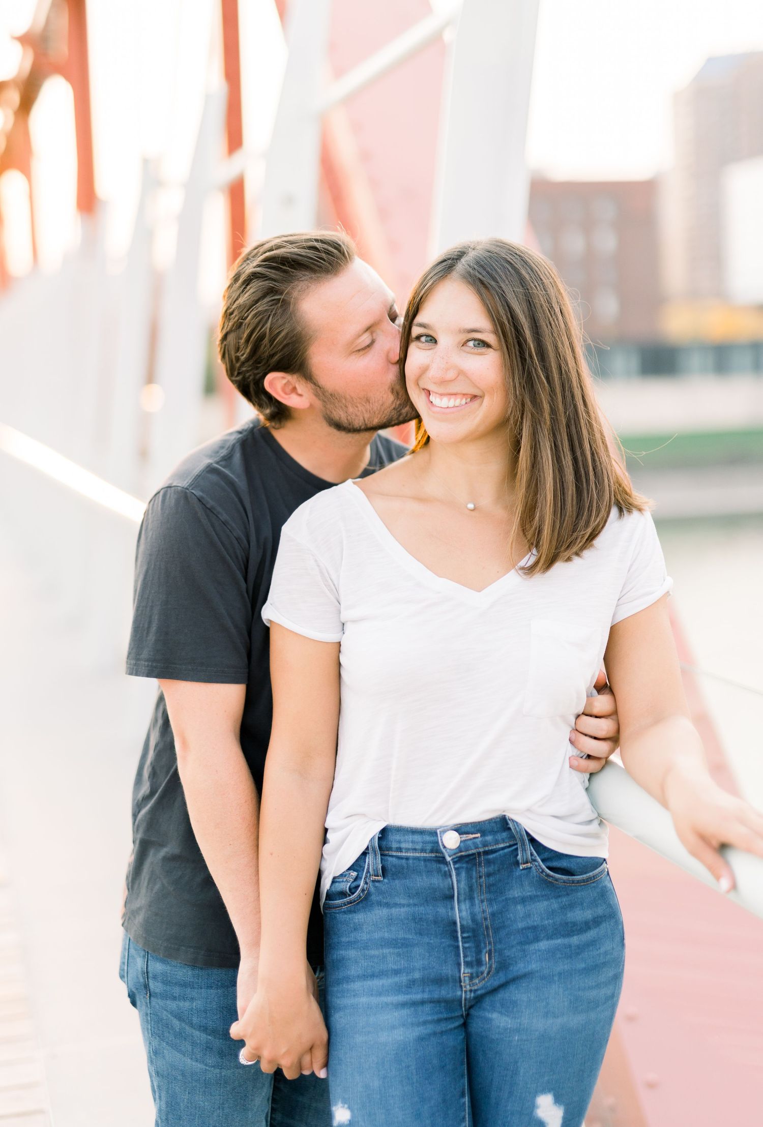 Des Moines Engagement photos in downtown Des Moines, Iowa with light and airy photographer Nicole Laing