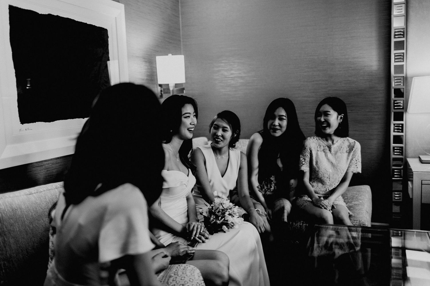 candid photo with bride and bridesmaids chatting