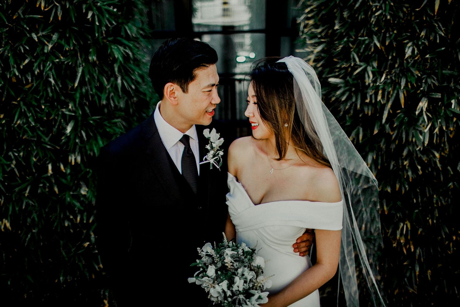 bride and groom looking at each other near a.o.c. la