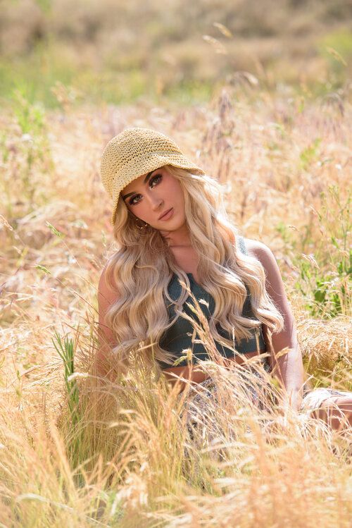 senior girl in field of grass