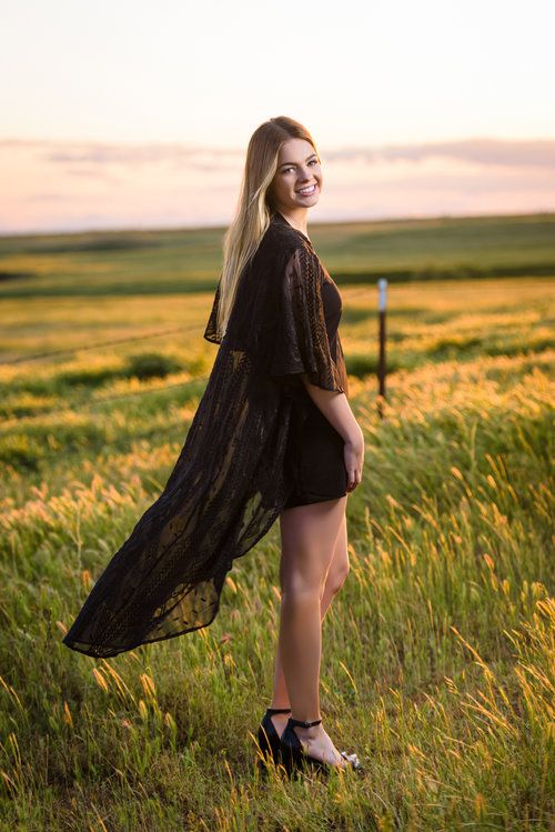 senior girls at sunset in field