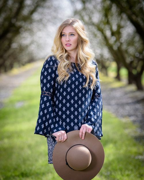 senior girl in almond blossoms