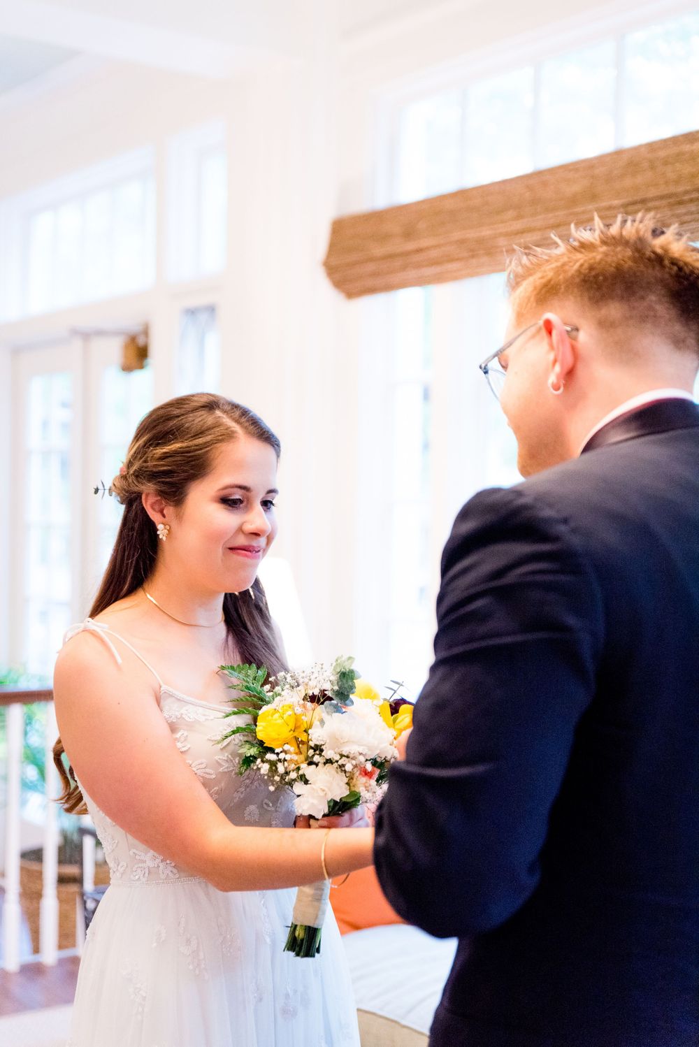 bride smirks at her groom during their first look at Woman's Club of Evanston Wedding