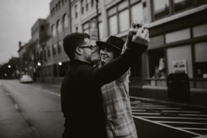 a couple in the middle of market street in corning ny