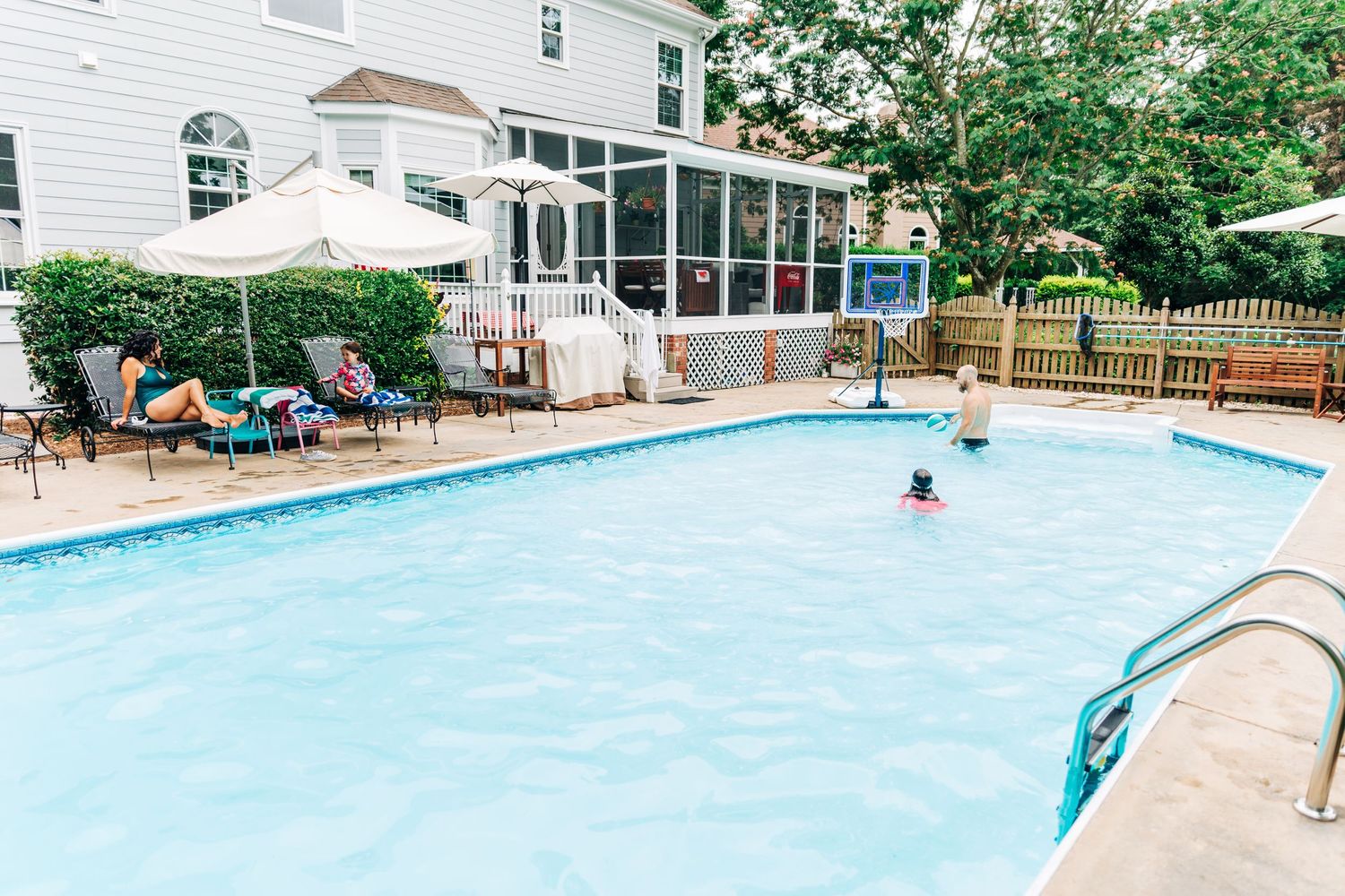 Family playing in their Charlotte, NC pool