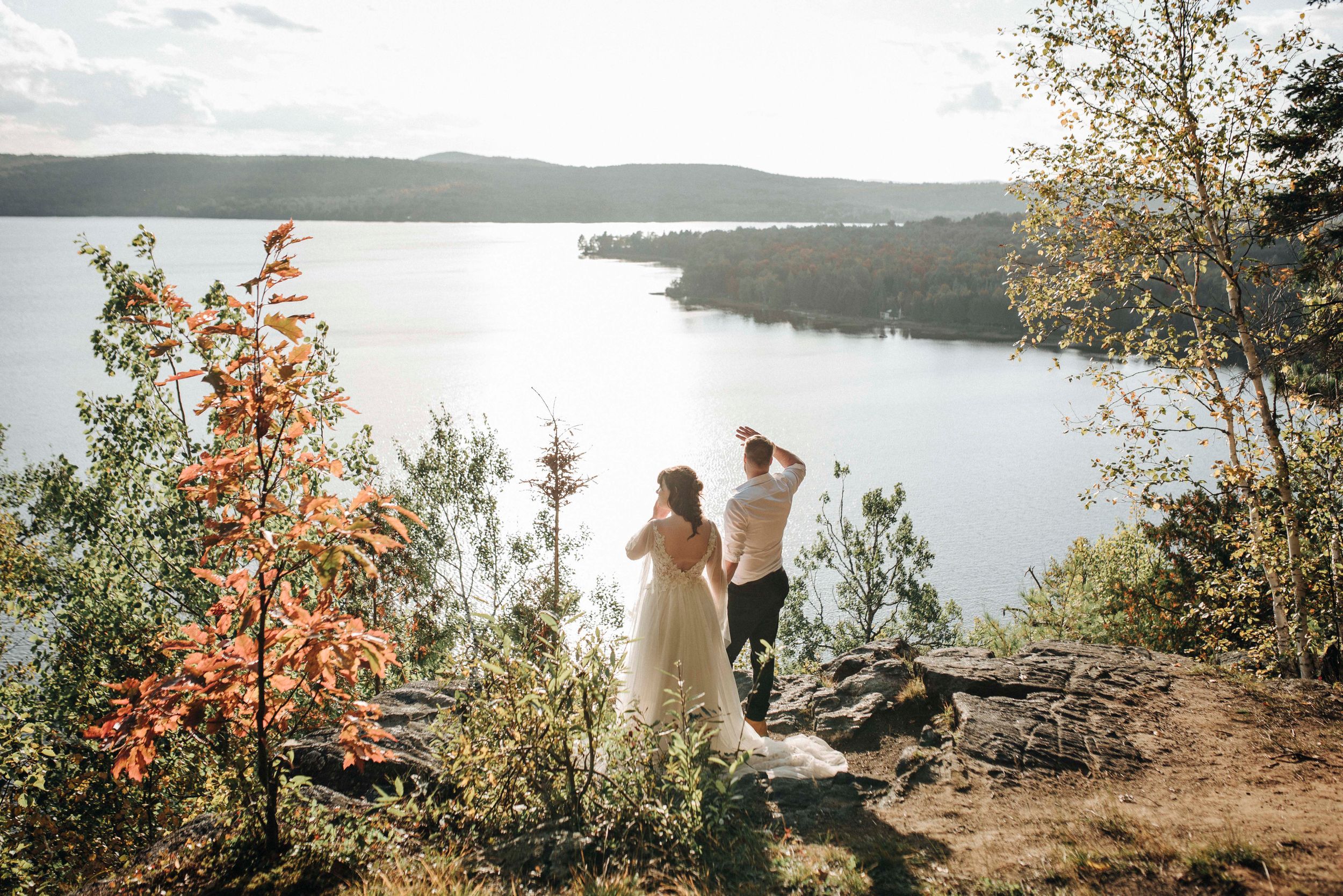 Bride and groom elopement on lakeside hill, Quebec