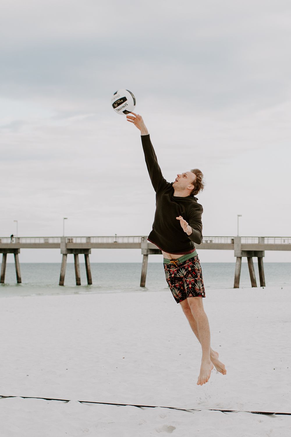 man about to hit a volleyball on Okaloosa Island