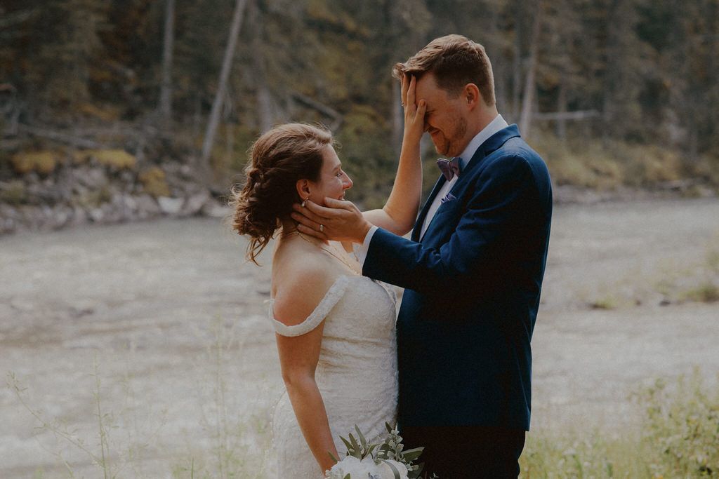 Emotional couple portrait in the Canadian Rockies with mountain backdrop | Calgary wedding photographers.