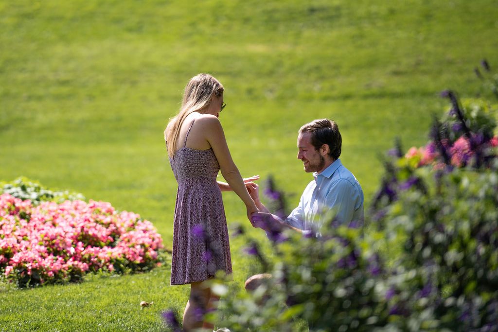 Cute couple sharing their love story through their engagement photos at a flower garden in San Francisco.