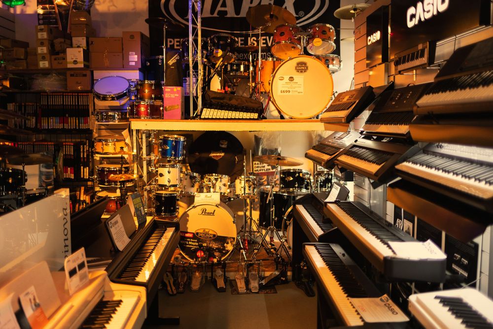 Collection of pianos, keyboards and drums.
