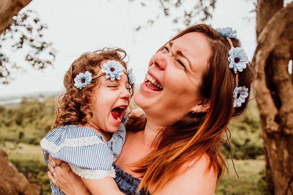 daughter and mother laughing out loud