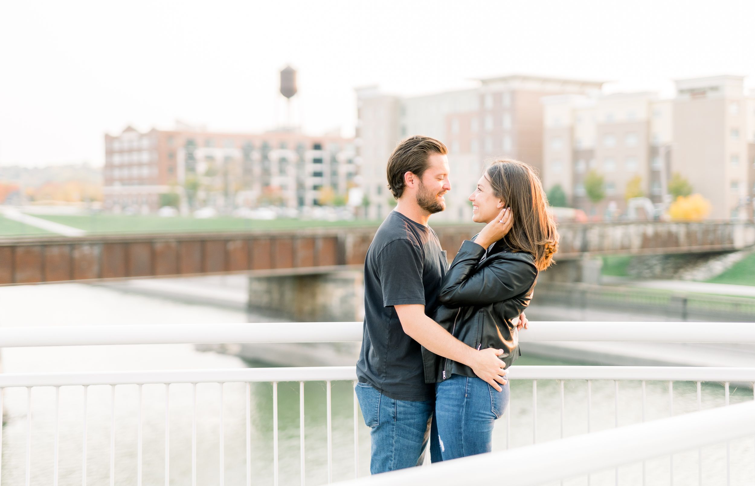 Des Moines Engagement photos in downtown Des Moines, Iowa with light and airy photographer Nicole Laing