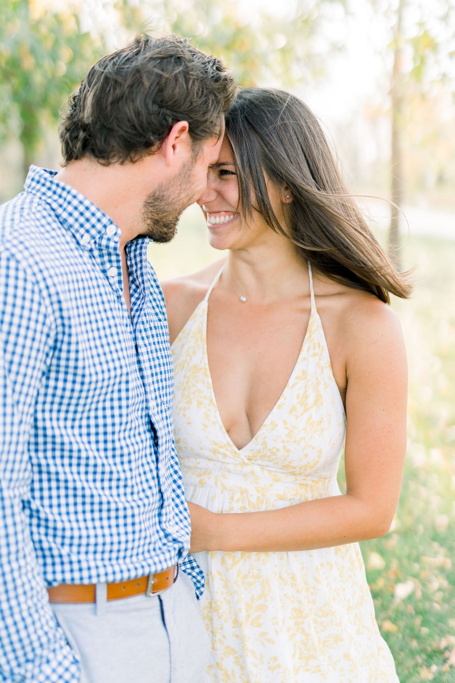 Des Moines Engagement photos at Grays Lake in downtown Des Moines, Iowa with light and airy photographer Nicole Laing