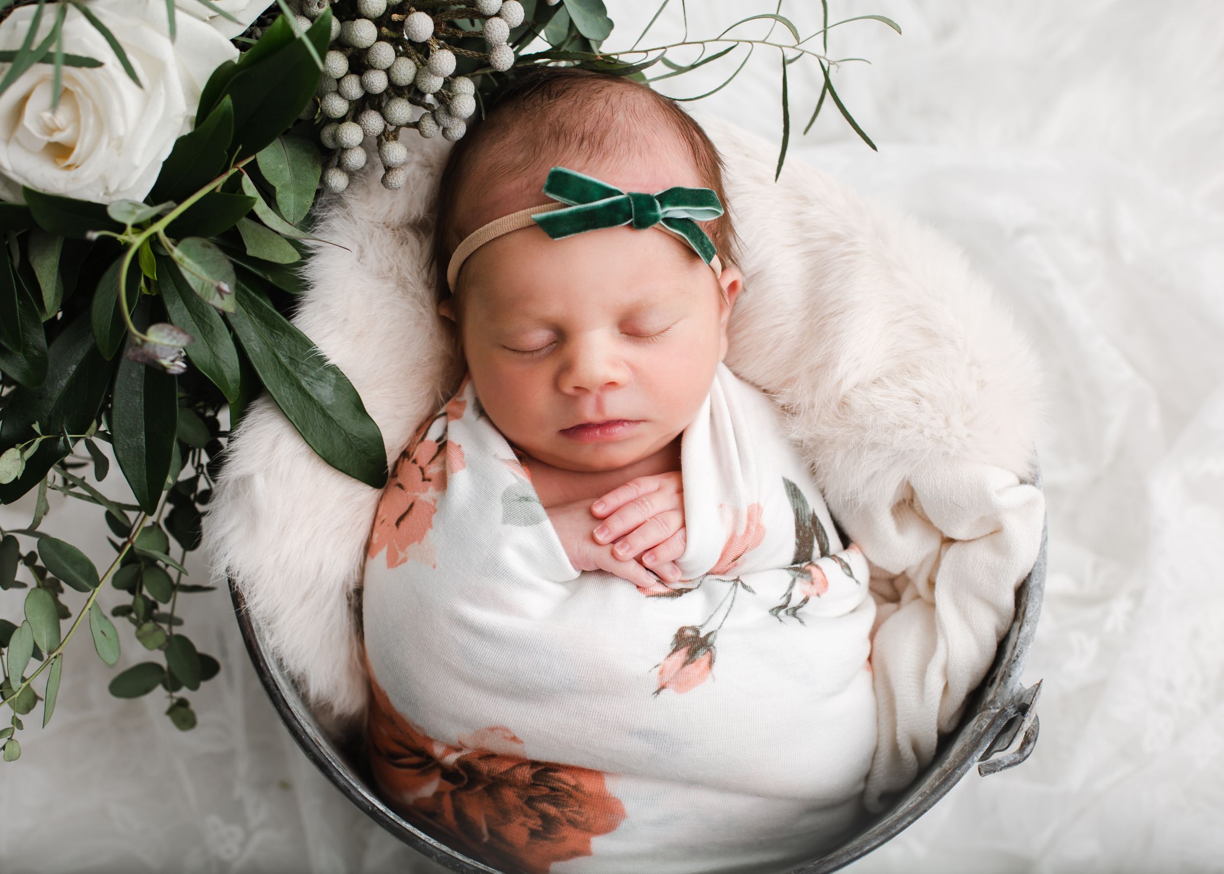 Newborn baby in posed bucket - Newborn photographer in Penticton