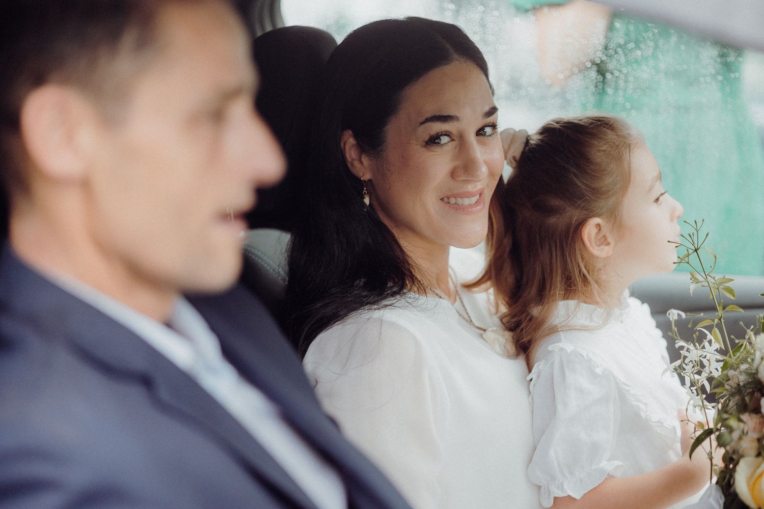 Wedding party sitting together during intimate celebration moment.