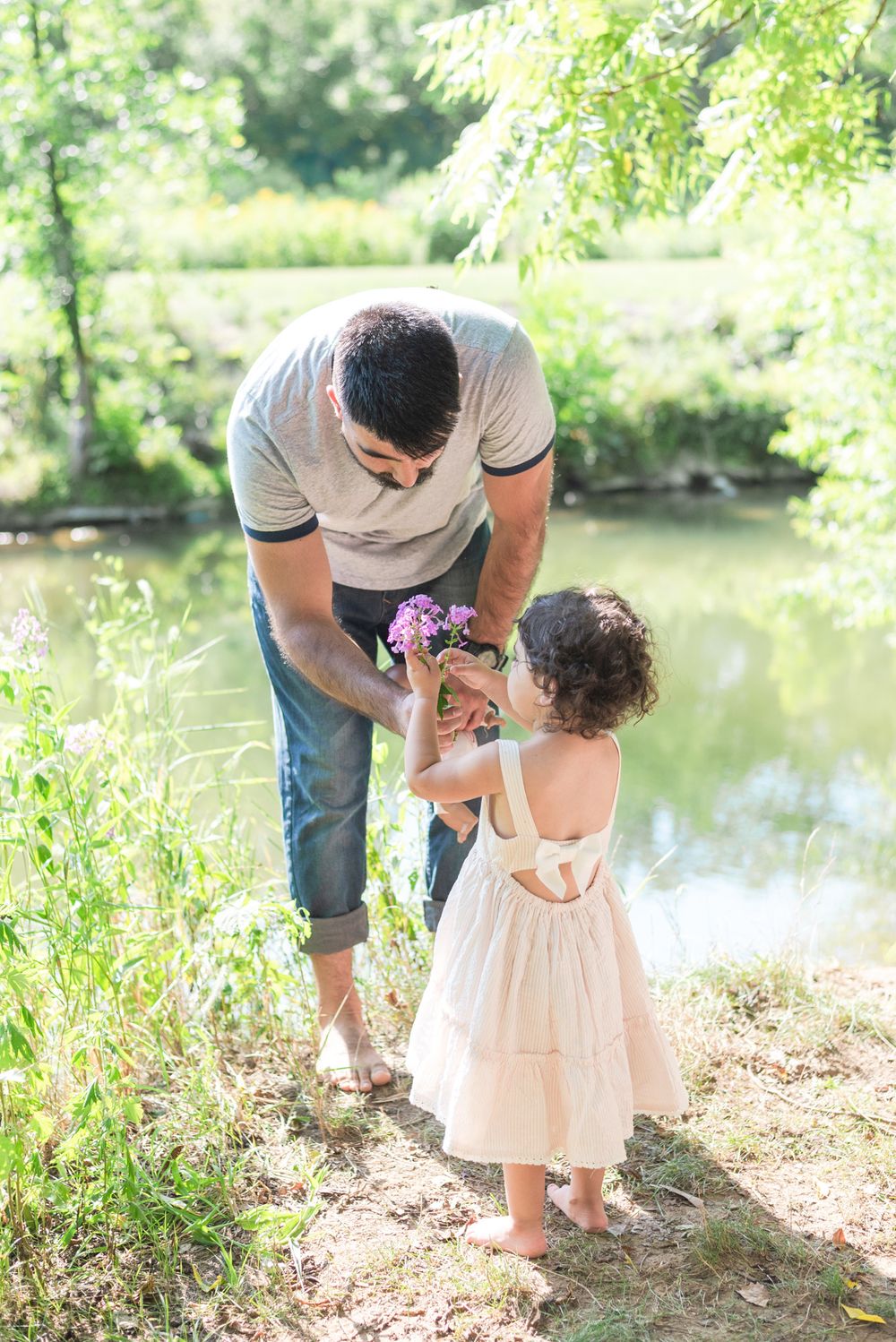 Dad giving daughter a flower at Emmerling Park in Cheswick Pennsylvania