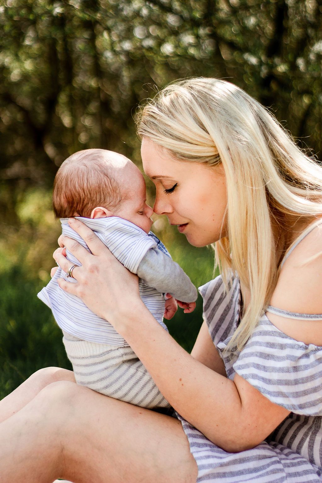 In a field in Havant, Hampshire a new Mum sits nose to nose with her Newborn Son.