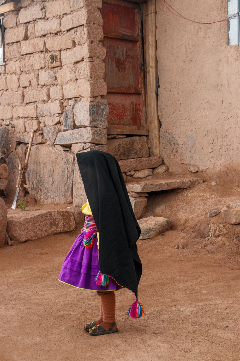 young girl in traditional dress Taquile Island, Lake Titicaca, Peru, South America