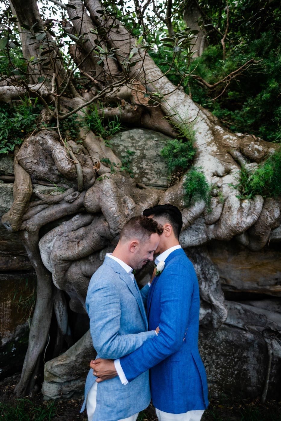 Gay couple hugging on wedding day