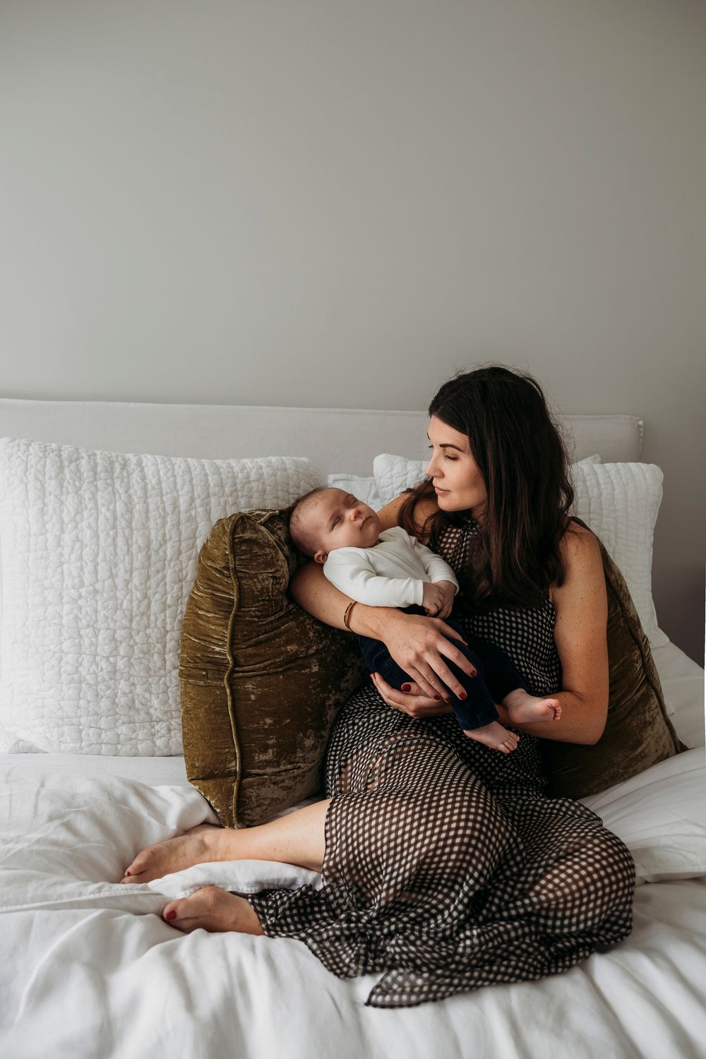 Mother and newborn baby relaxed in home lifestyle photography