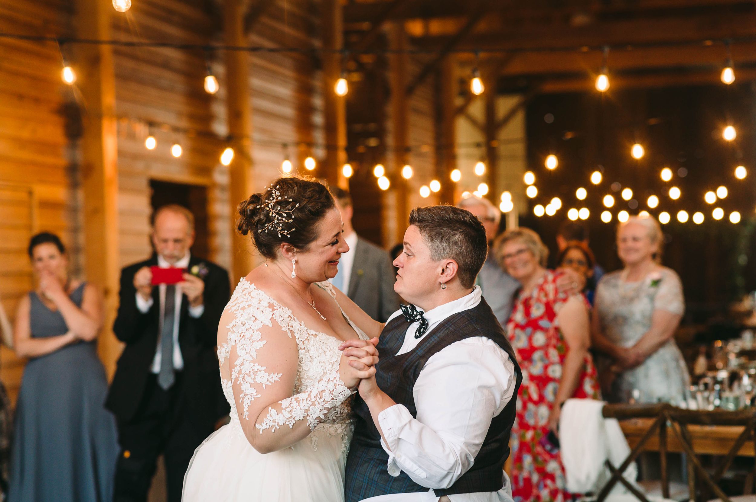 Lesbian Brides having their first dance at their wedding reception.