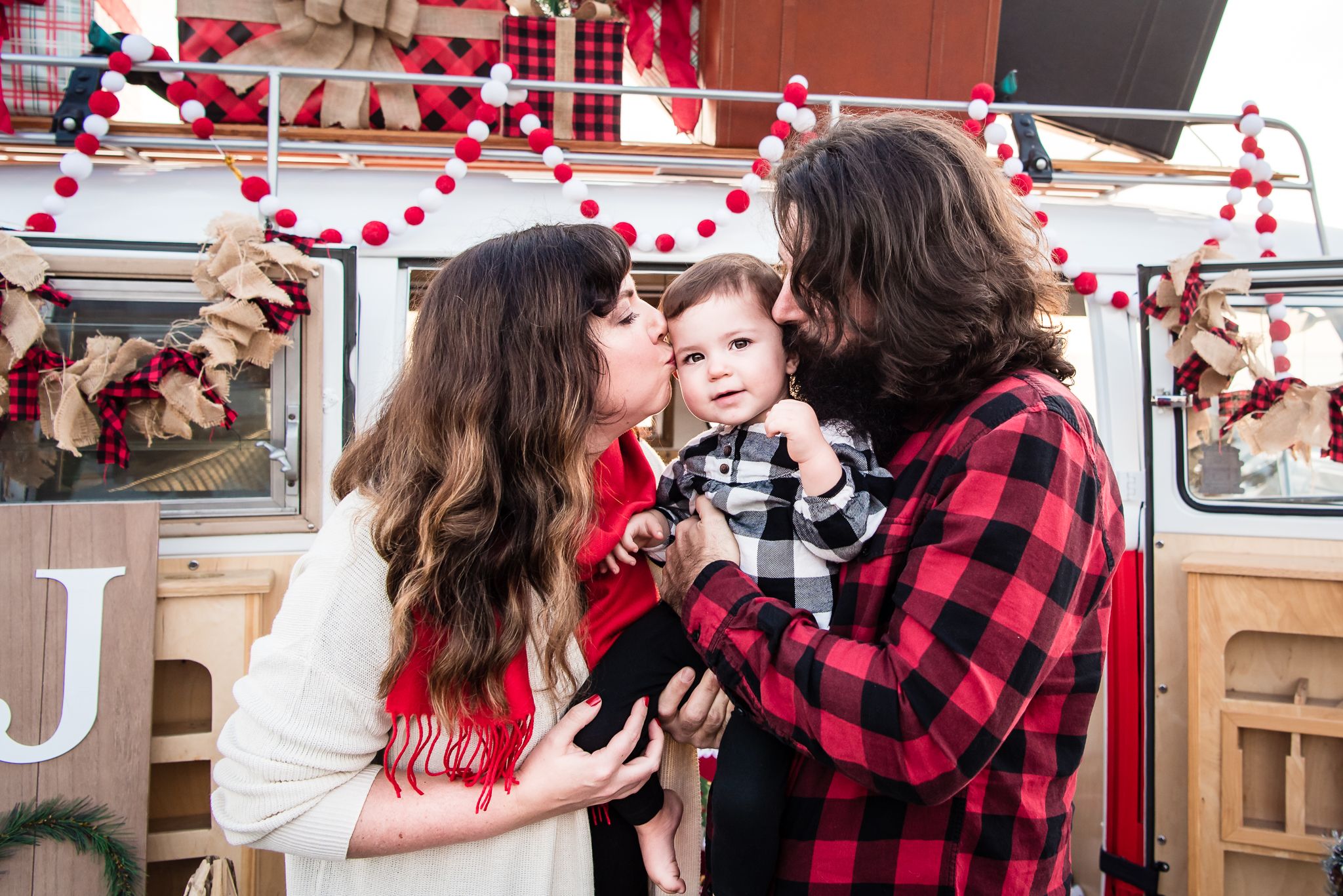Image of a family with a VW bus decorated for Christmas in Orange County, CA