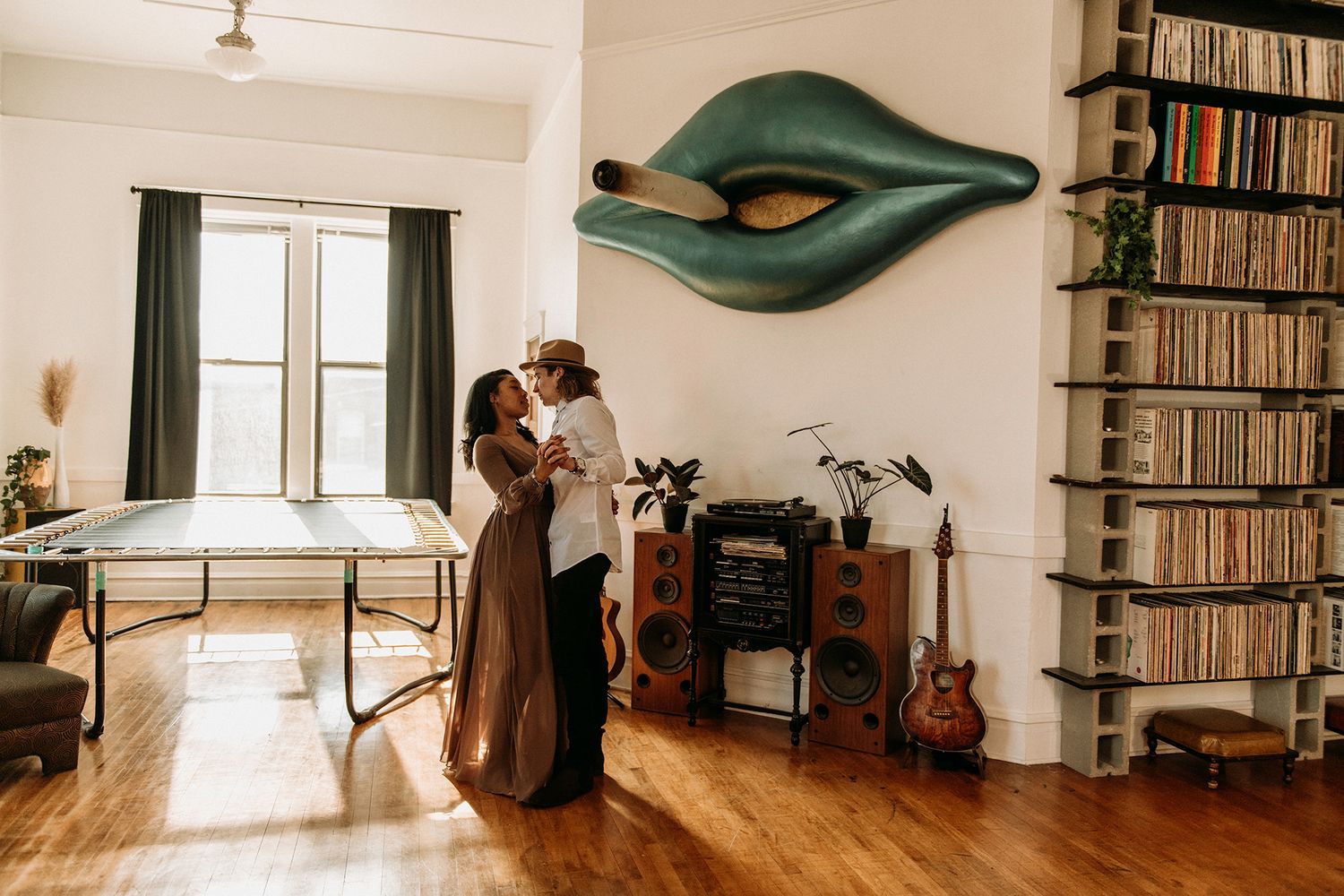 man and woman looking into each other's eyes as they dance with one another