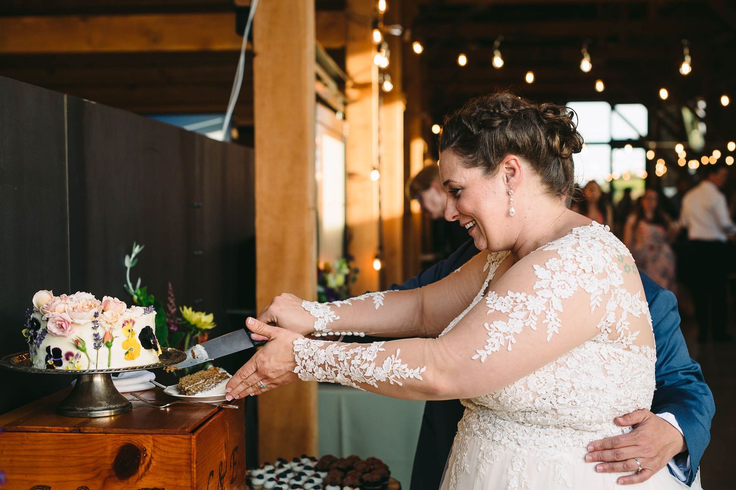 Bride and bride cutting the wedding cake
