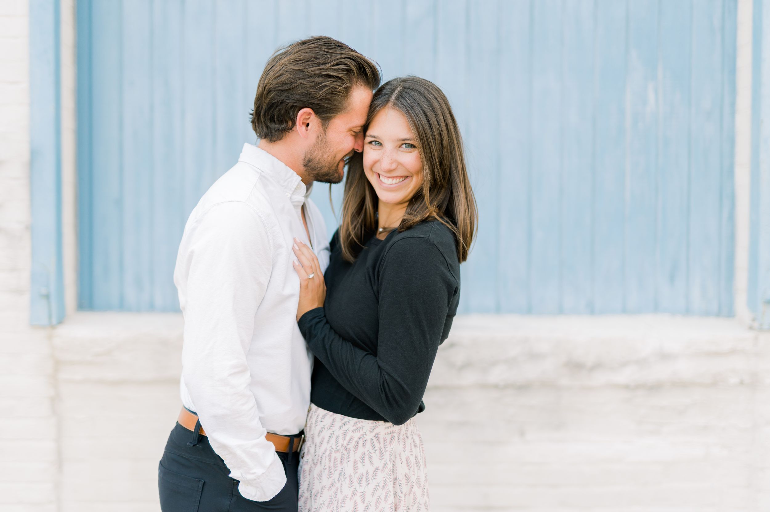 Light and airy film engagement photos in Des Moines, Iowa at downtown des moines