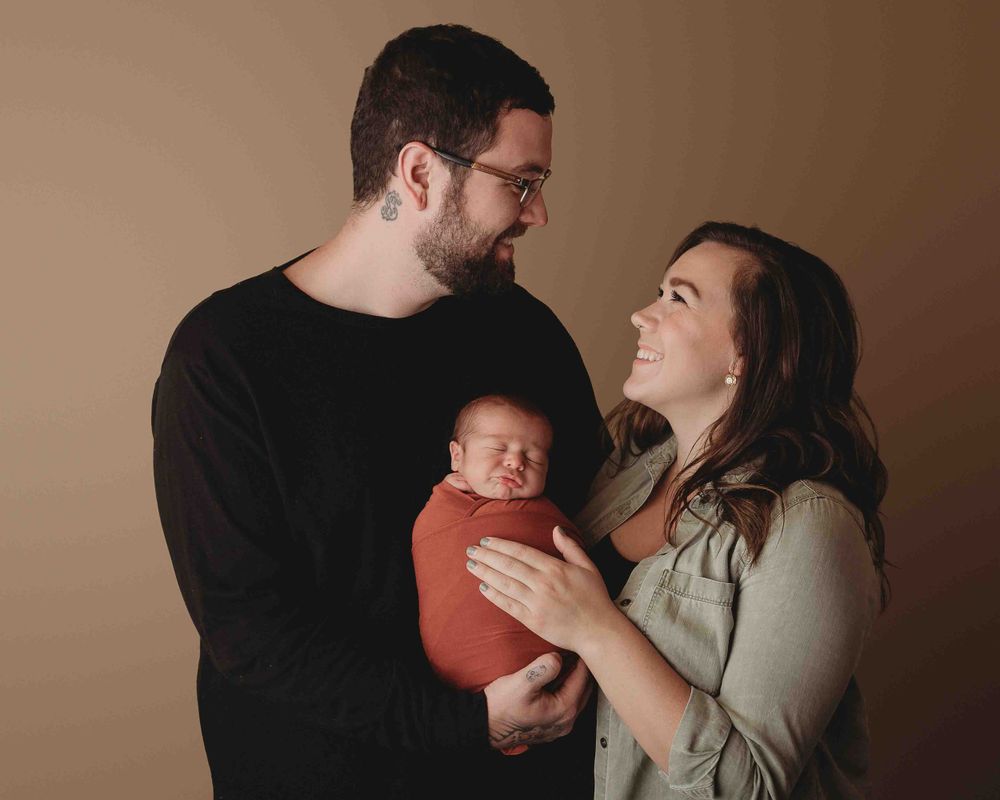 Professional newborn photo with mom and dad