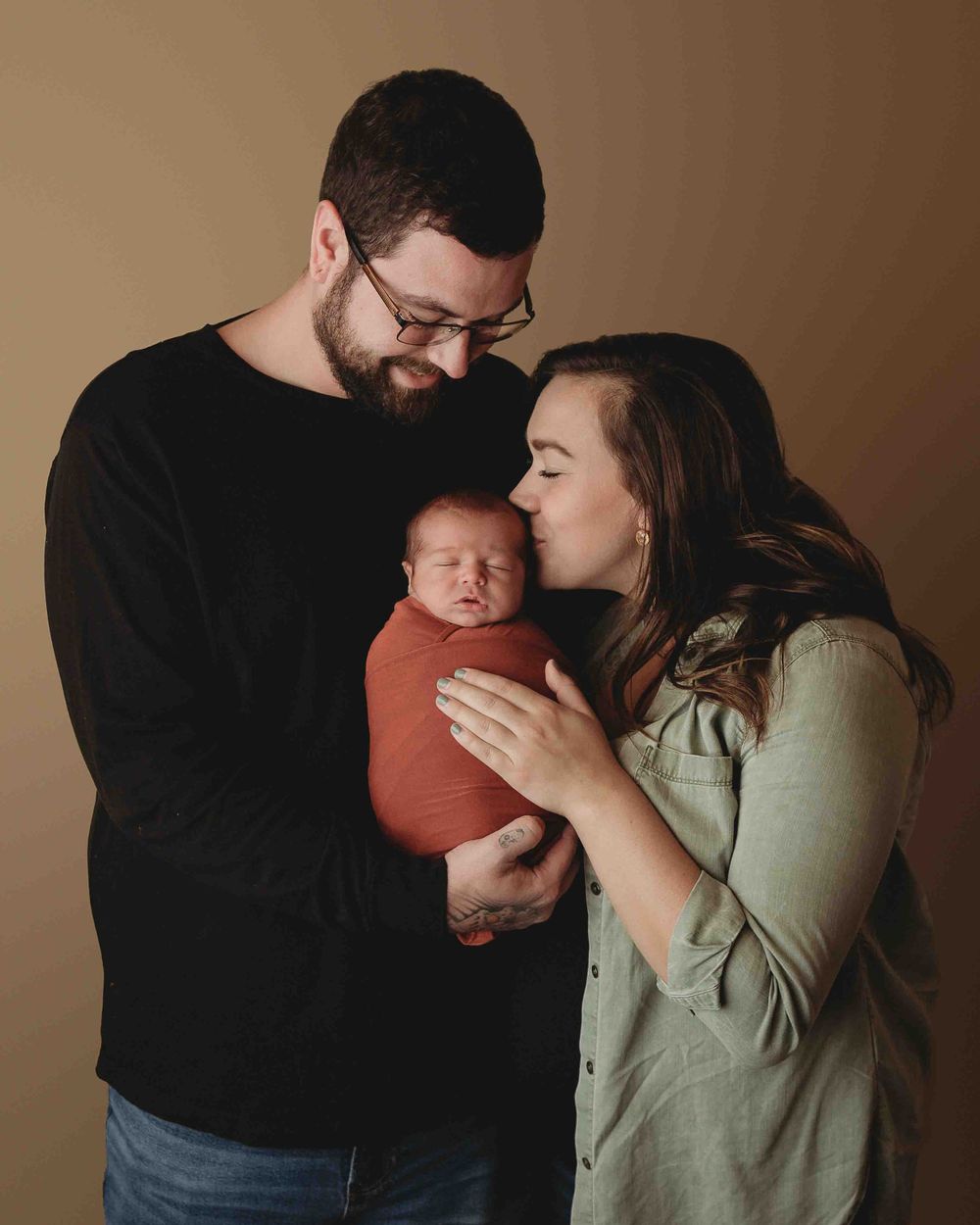 Professional newborn photo with mom and dad