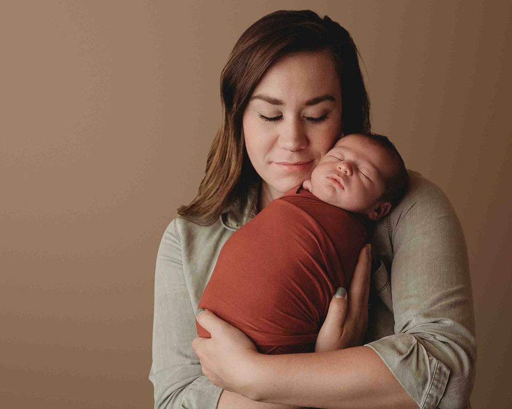 Professional newborn photo with mom